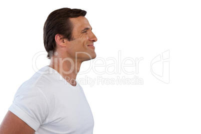 Side view of smiling mature man looking away