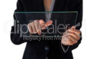 Mid section of businesswoman touching glass interface