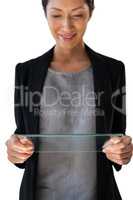 Smiling businesswoman looking at glass interface