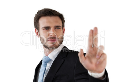 Confident businessman touching invisible interface