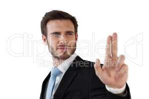 Confident businessman touching invisible interface