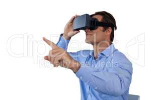 Businessman gesturing while using  virtual reality simulator