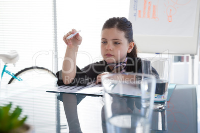 Thoughtful businesswoman at desk