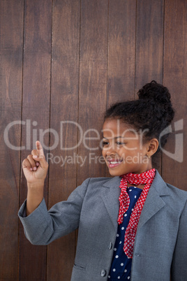 Smiling businesswoman touching invisible interface