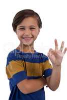Cute boy gesturing okay hand sign