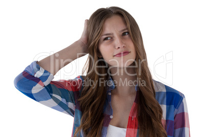 Teenage girl standing against white background