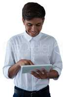 Boy using digital tablet