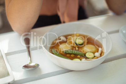 Fresh vegetable soup on table