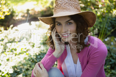 Beautiful woman smiling at camera in garden