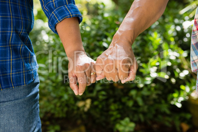 Senior couple holding hands