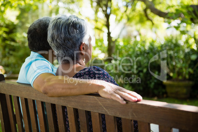 Senior couple sitting in garden on a sunny day