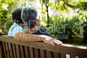 Senior couple sitting in garden on a sunny day