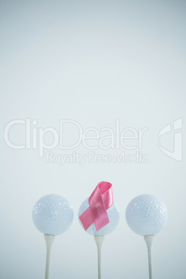 Pink Breast Cancer ribbon on golf ball