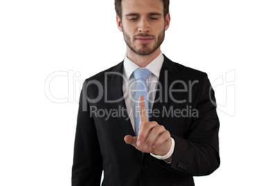 Businessman touching index finger on invisible interface