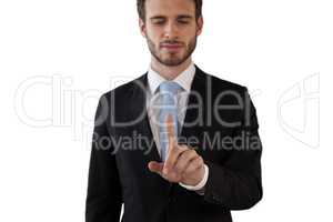 Businessman touching index finger on invisible interface