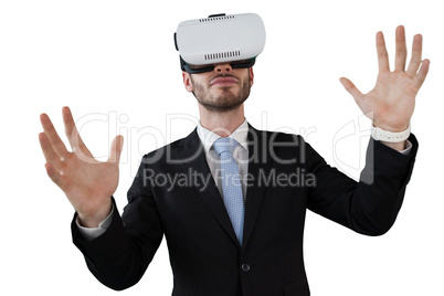 Businessman with vr glasses gesturing against white background