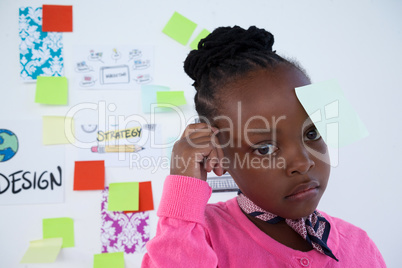 Thoughtful businesswoman with adhesive notes