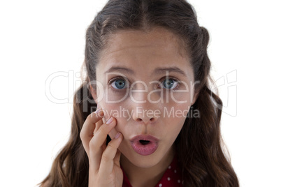 Teenage girl standing against white background