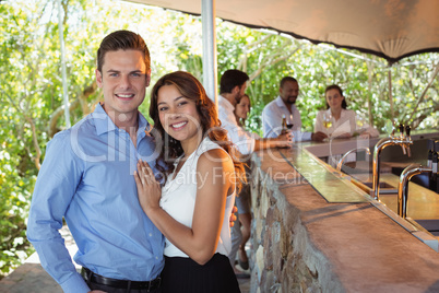 Couple standing at counter in restaurant