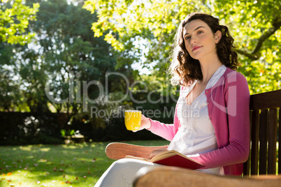 Thoughtful woman having a cup of coffee