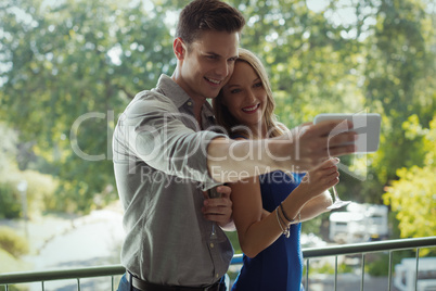 Couple taking selfie on mobile phone