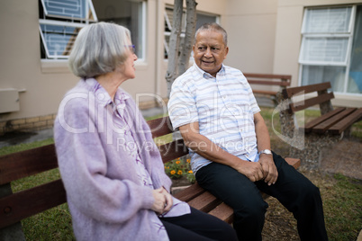 Senior friends sitting on bench