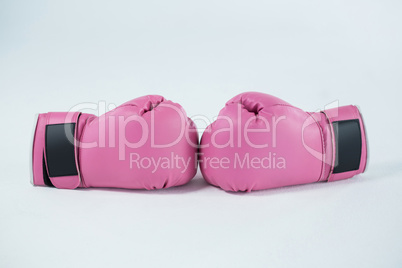 Close-up pair of pink boxing gloves