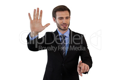 Smiling businessman in suit using invisible interface