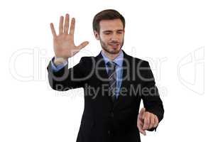 Smiling businessman in suit using invisible interface