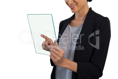 Mid section of happy businesswoman touching glass interface