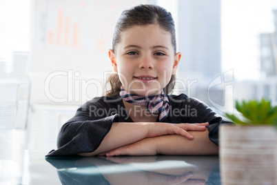 Close up portrait of businesswoman at desk