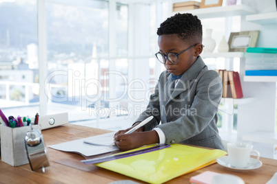 Businessman working at desk in office