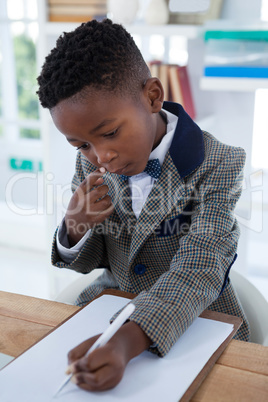 High angle view of businessman writing on paper at clipboard High angle view of businessman writing on paper at clipboard