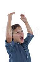 Cute boy shouting against white background