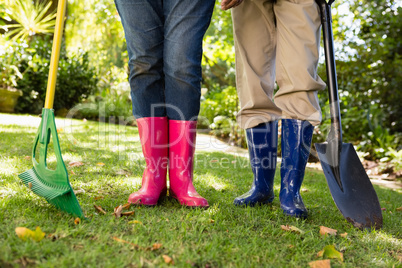 Senior couple standing in garden on a sunny day