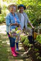 Senior couple standing in garden on a sunny day