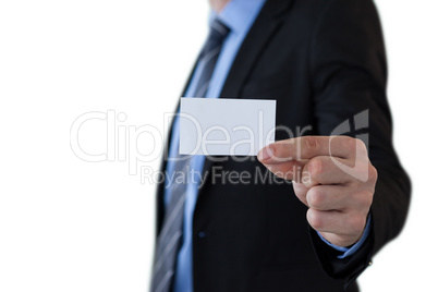 Mid section of businessman holding piece of paper