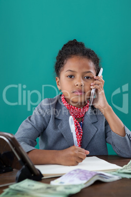 Portrait of businesswoman talking on mobile phone