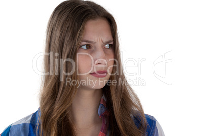 Teenage girl standing against white background