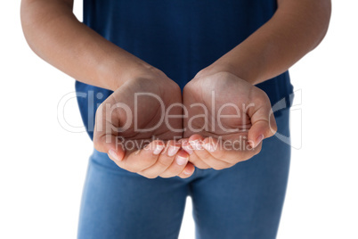 Girl with hand cupped against white background