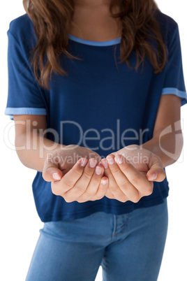 Girl with hand cupped against white background