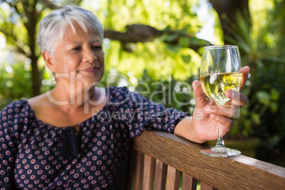 Senior woman holding wine glass