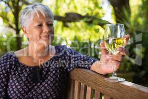 Senior woman holding wine glass