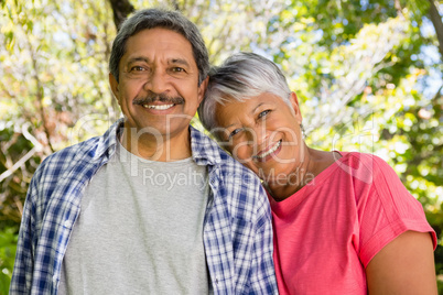 Portrait of smiling senior couple in garden