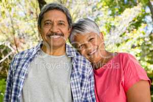 Portrait of smiling senior couple in garden