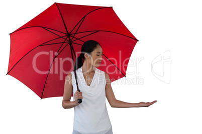 Young woman holding umbrella