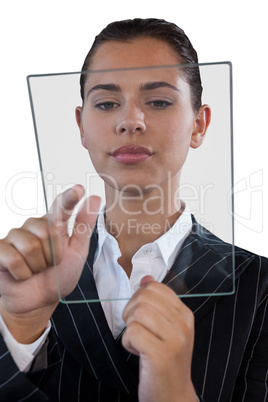 Close up of young businesswoman using glass interface