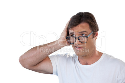 Confused mature man wearing eyeglasses looking away