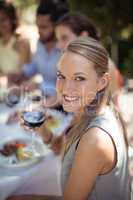 Woman holding a wine glass in restaurant