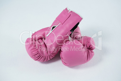 High angle view of pink boxing gloves pair